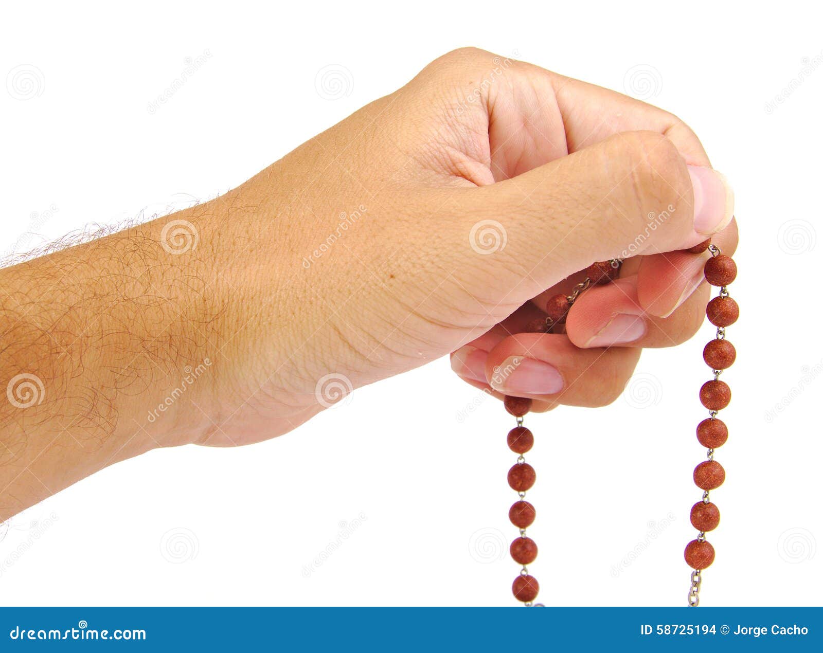 hands of a believer with wooden rosary