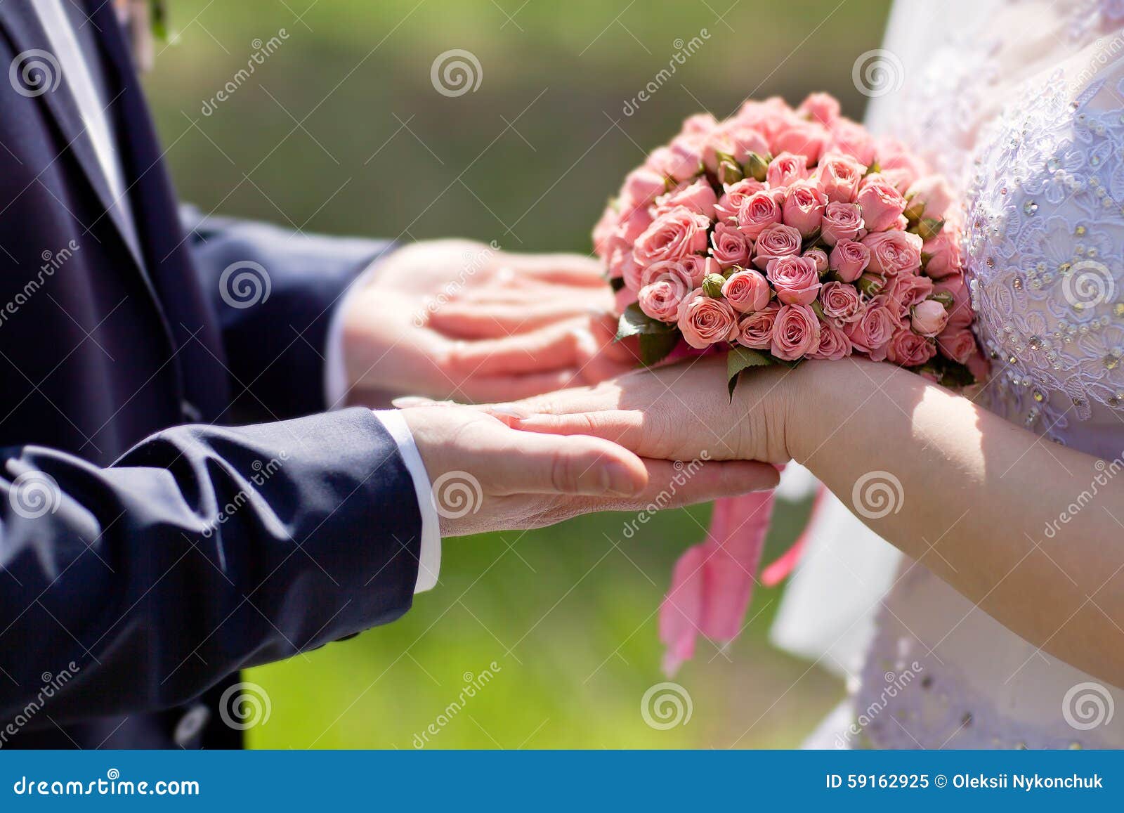 Hands of Bride and Groom Holding a Bouquet of Pink Roses Stock Image ...