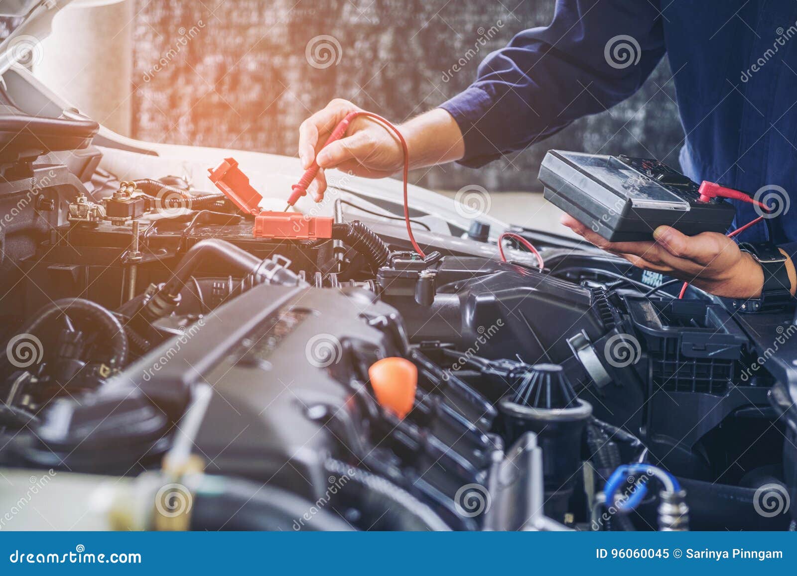 hands of car mechanic working auto repair service.