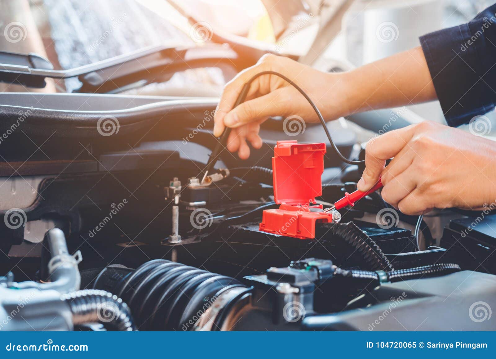 Hands Check Battery Car Mechanic Working in Auto Repair Service Stock