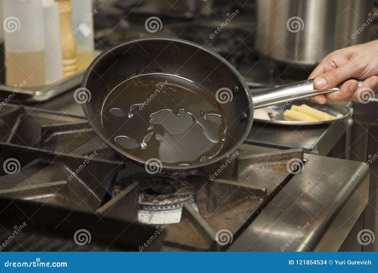 The Hands of the Chef Heating the Pan Stock Photo Image of person