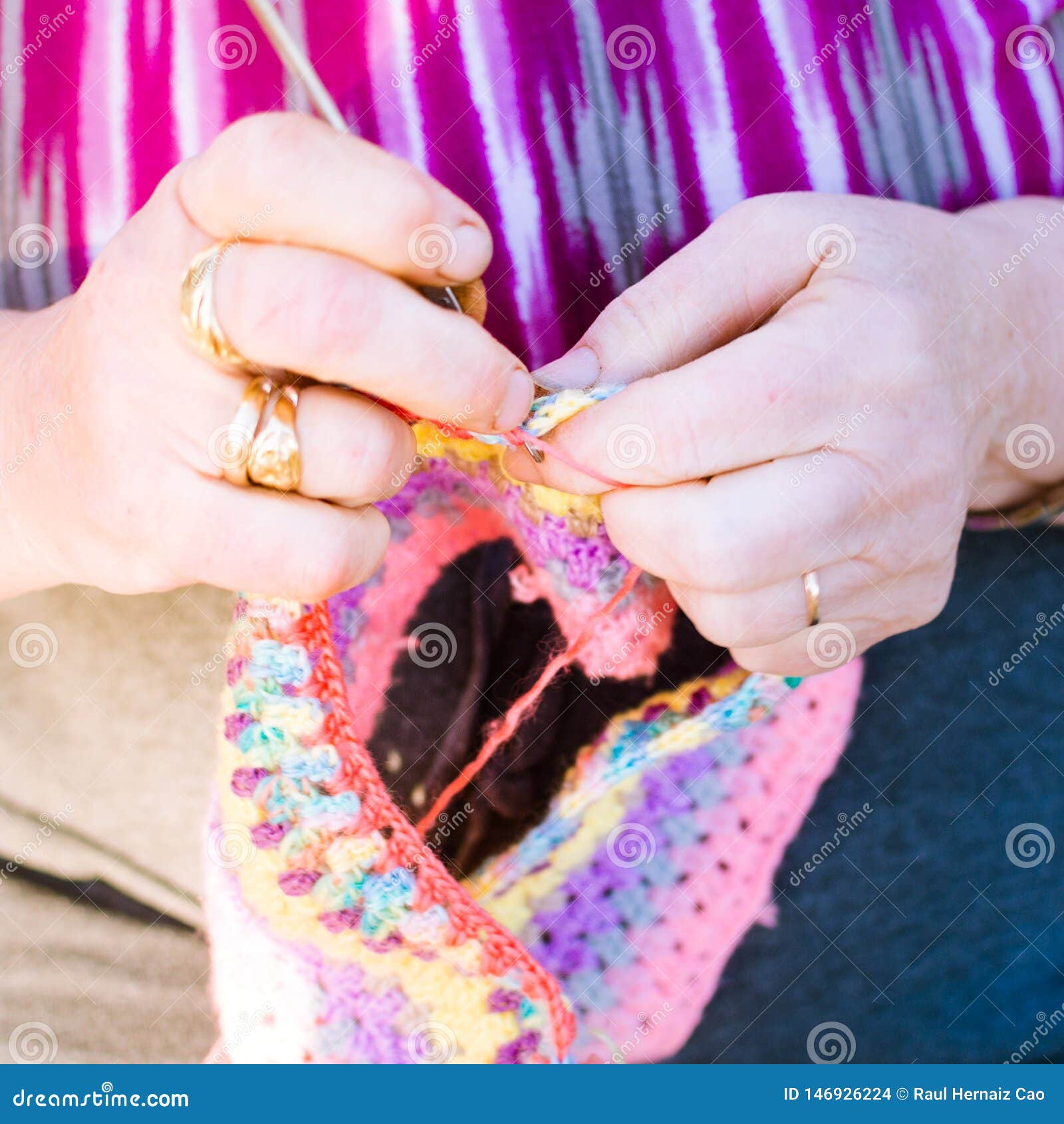 Old Lady Knitting on Knitting Needles, Using Colorful Wool. Hobby for