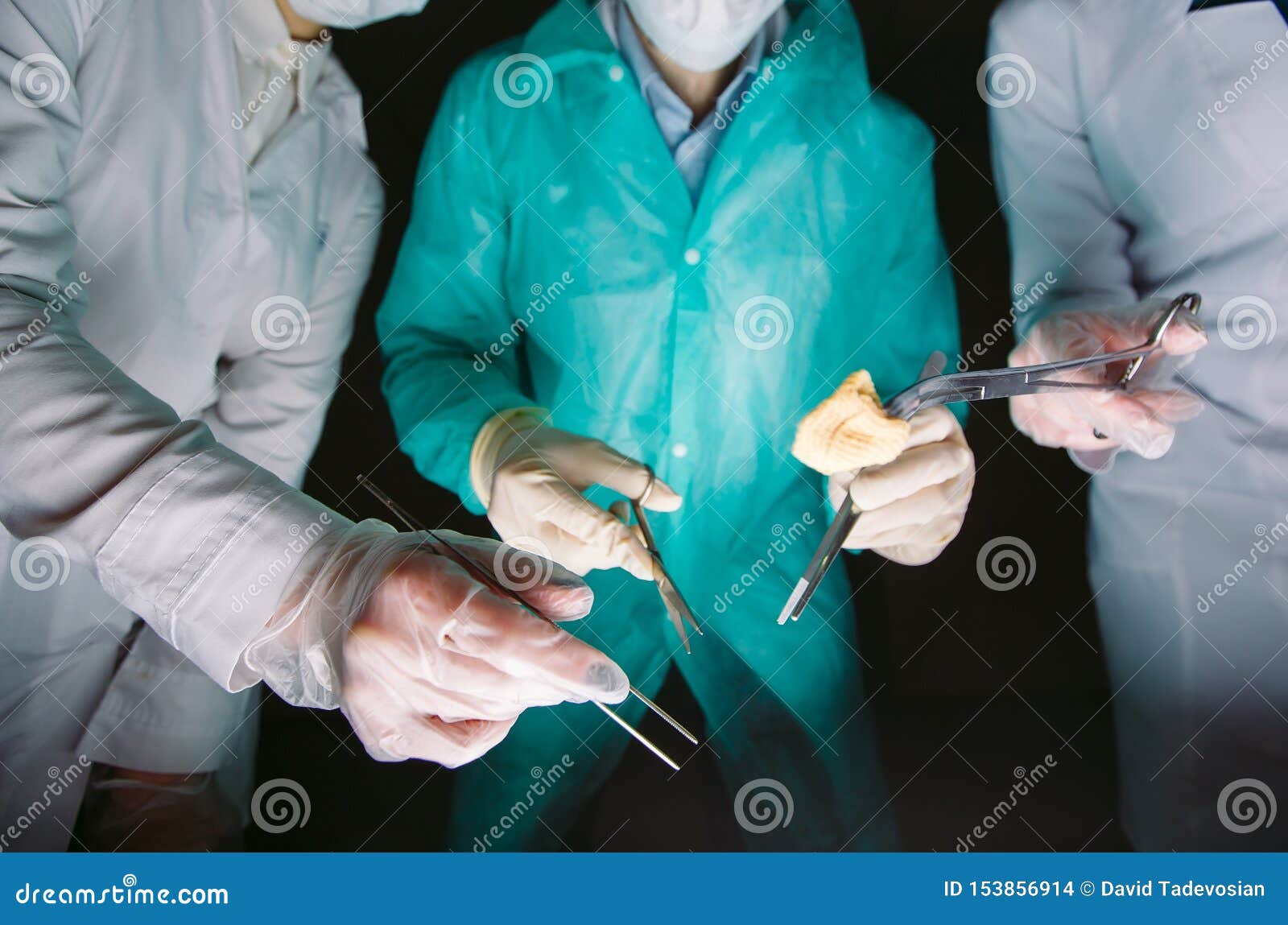 Hands Closeup of Surgeons Holding Medical Instruments. the Surgeon