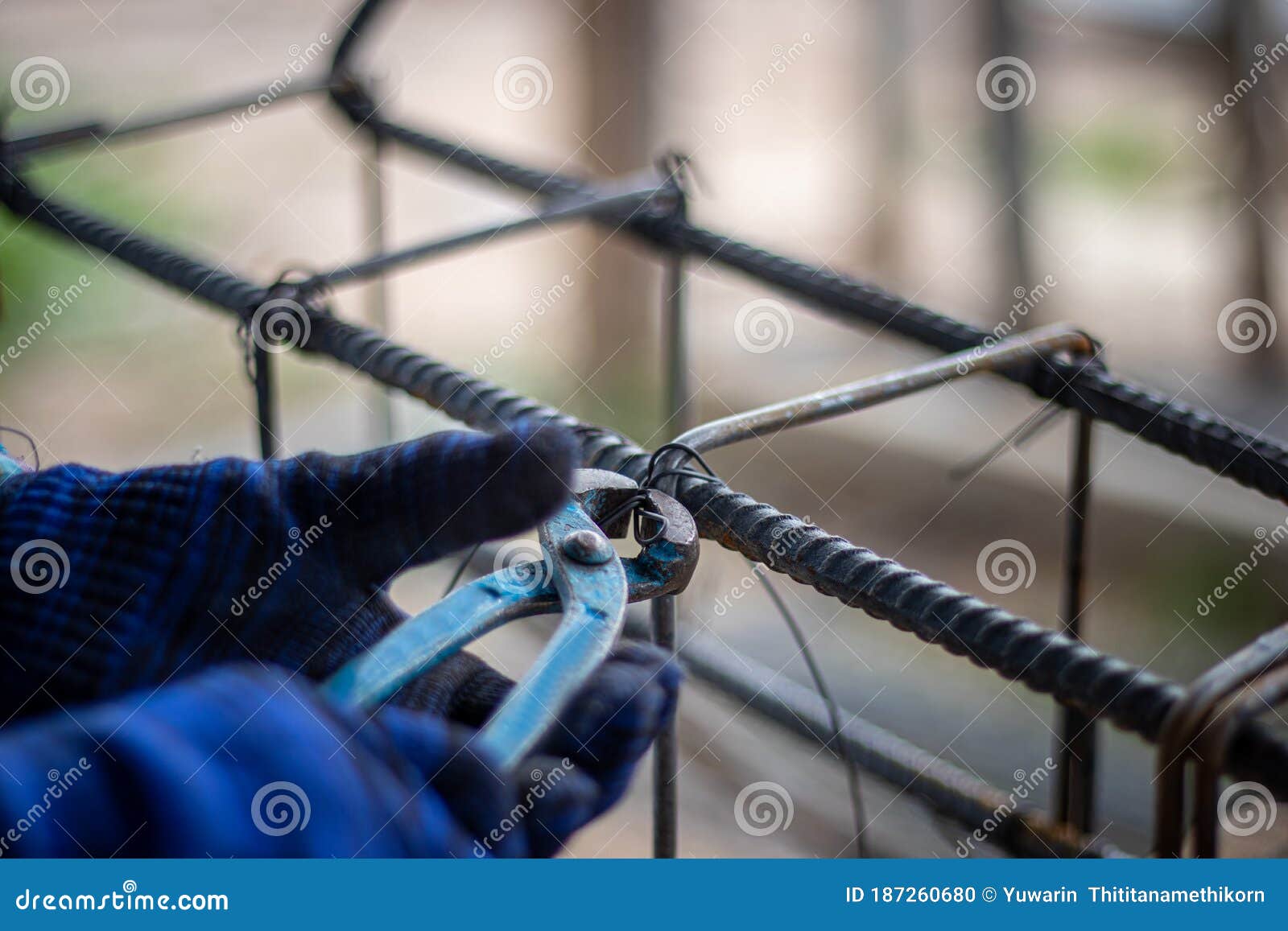 The Hands of Construction Workers Using Using Steel Wire To Bind Steel