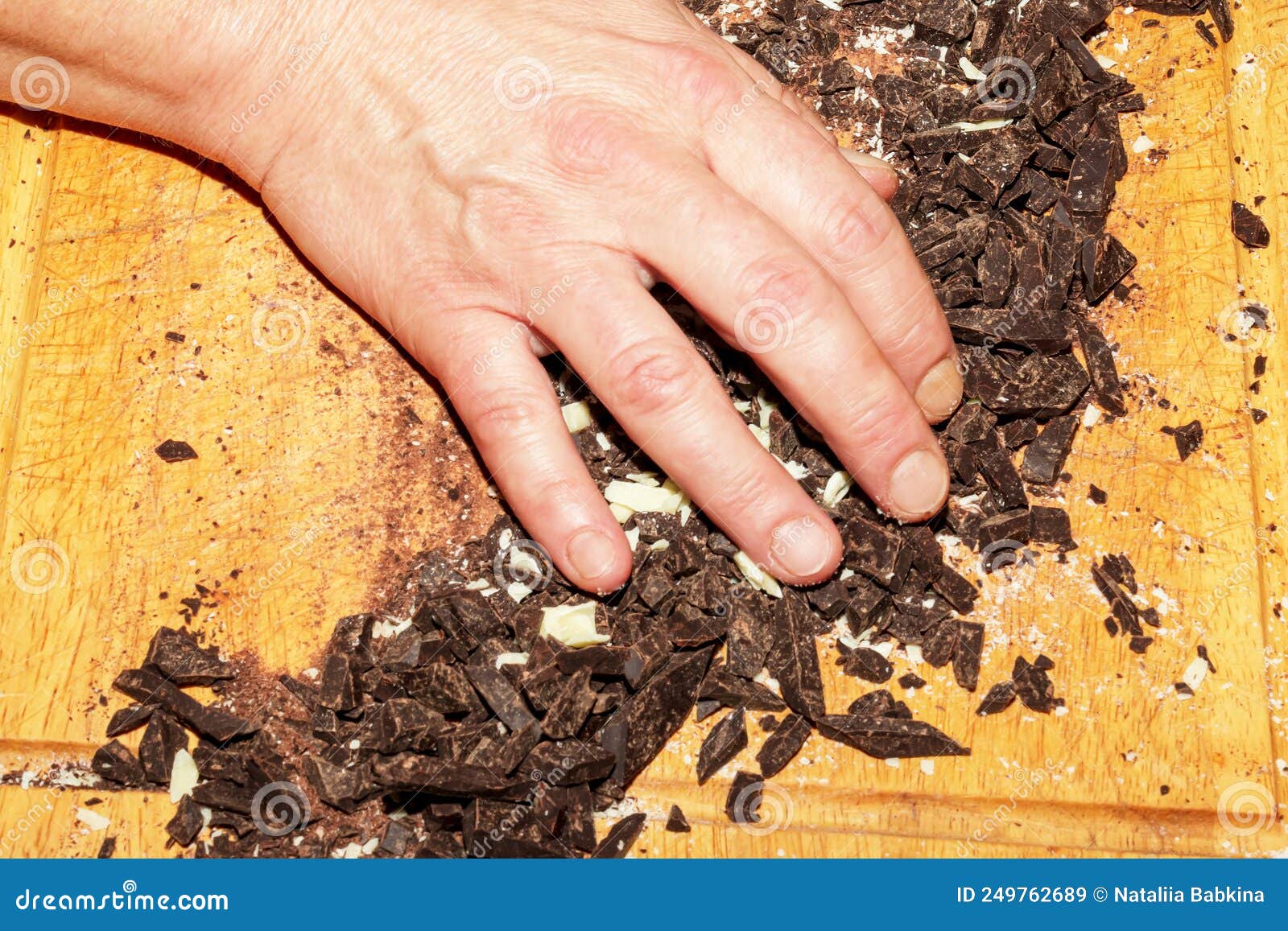 The Hands of the Cook Pour the Crushed Cocoa Butter and Grated Cocoa