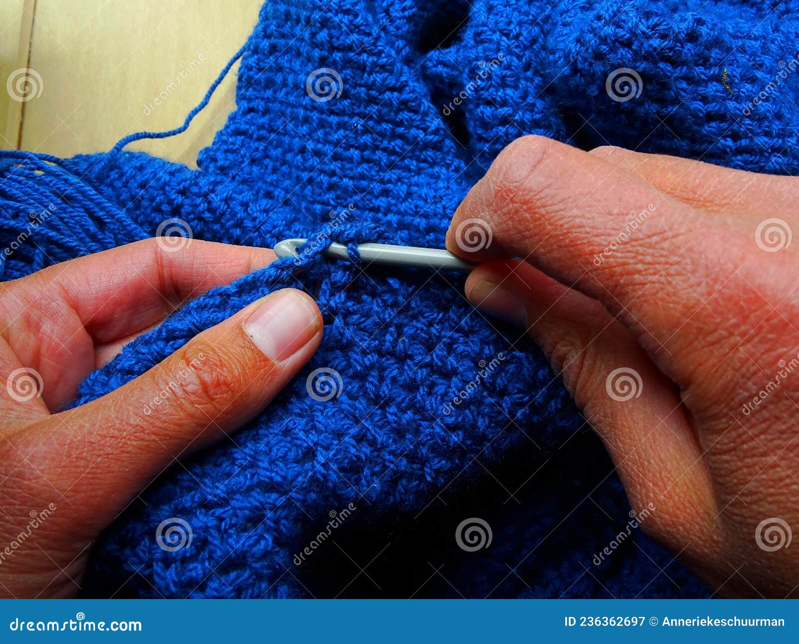Hands that are Crocheting with Blue Wool Stock Image Image of home