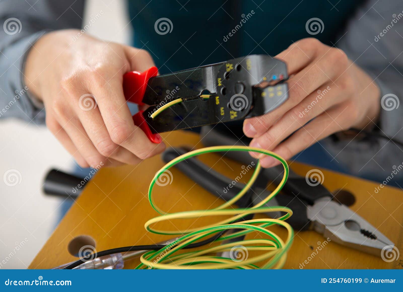 Hands cut electric cable stock image. Image of case 254760199