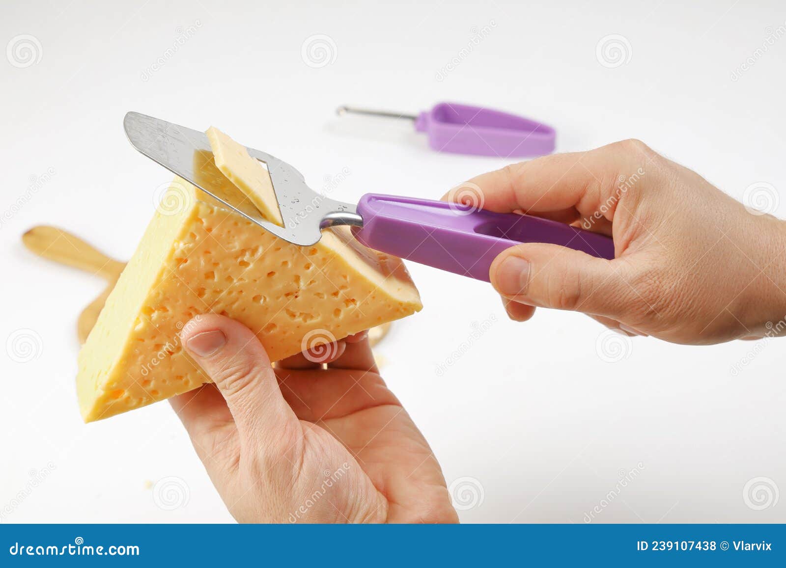 Hands Cut Piece of Cheese Using Special Tool for Cutting Slices Stock