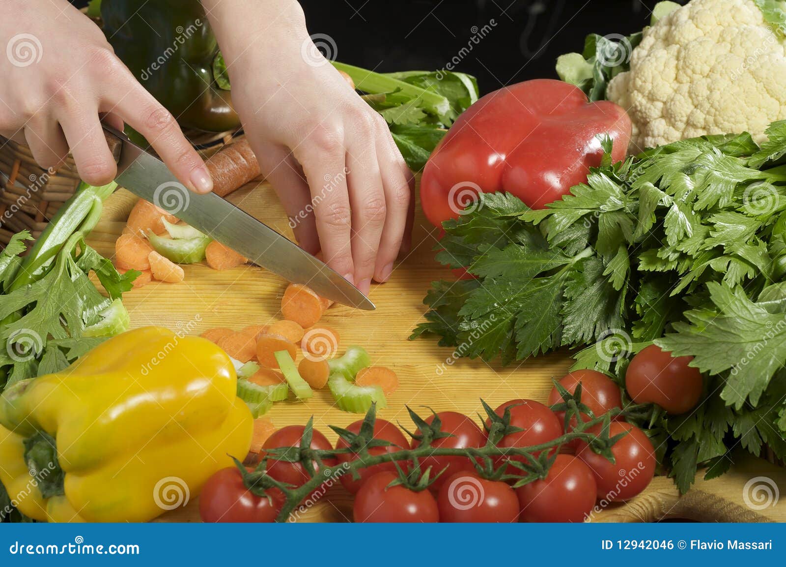 Hands cutting vegetables stock photo. Image of leaf, preparing 12942046