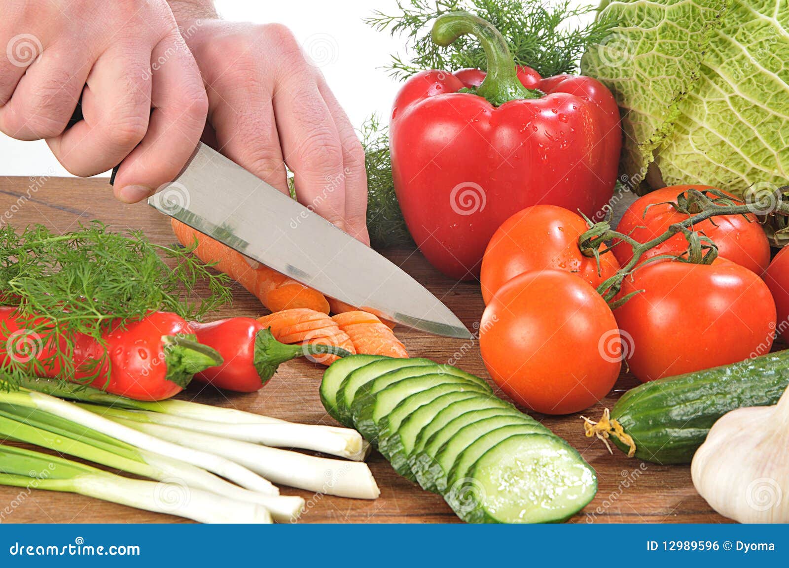 Hands cutting vegetables stock photo. Image of studio 12989596