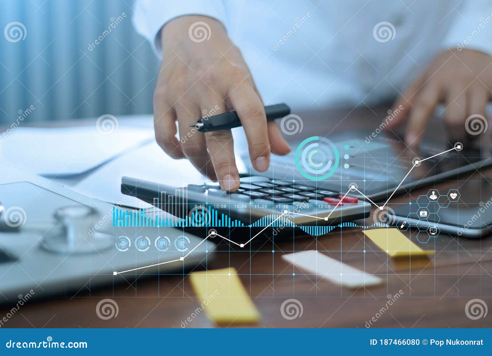 hands of doctor doing finances and calculate on table and healthcare business graph data and growth on hospital background