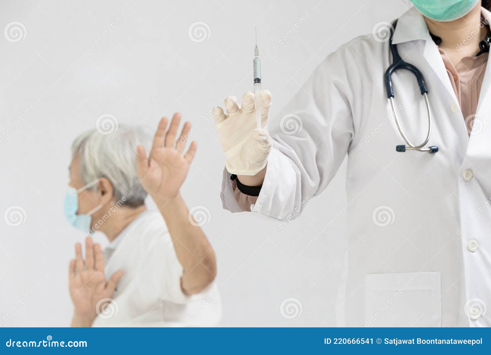 hands of doctor preparing a syringe to inject the elderly,old people showing distrustful of covid-19 vaccine,rejecting medicine,