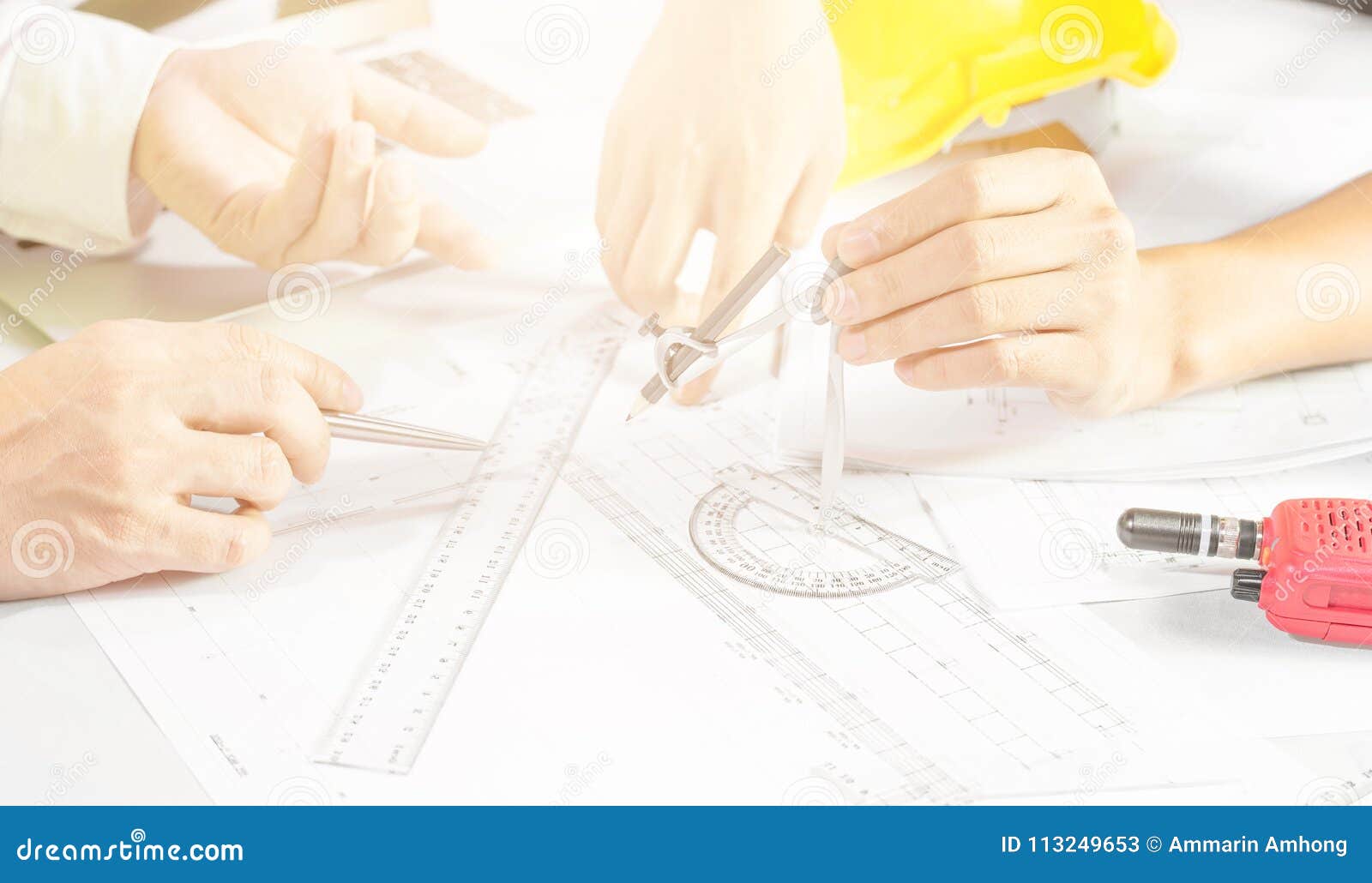 hands of engineer working  on blueprint,construction concept