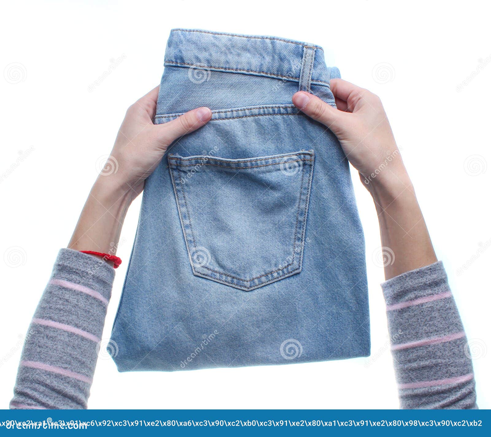 Hands folding jeans stock photo. Image of garment, clothing 136762610