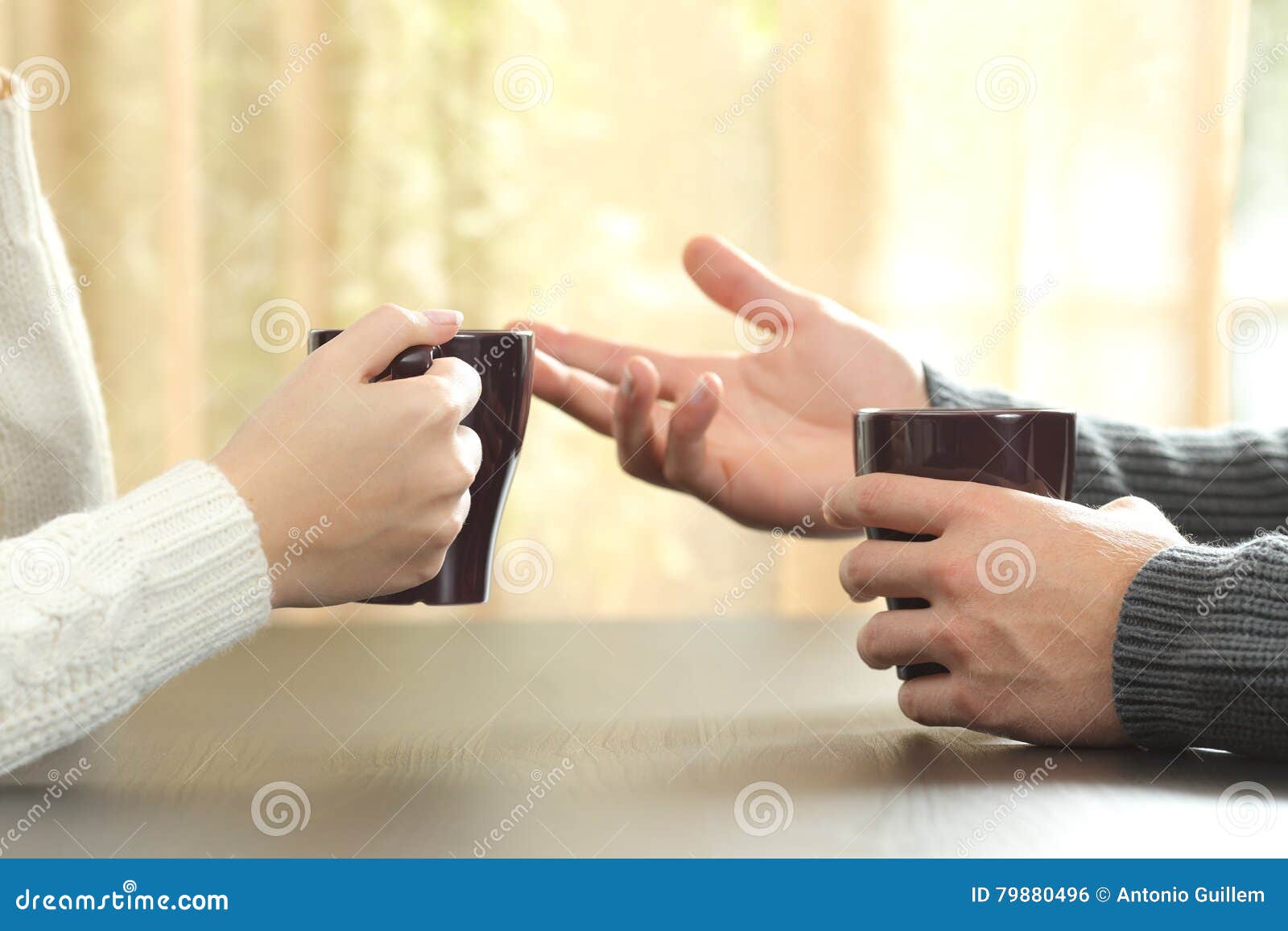 hands of friends with coffee cups