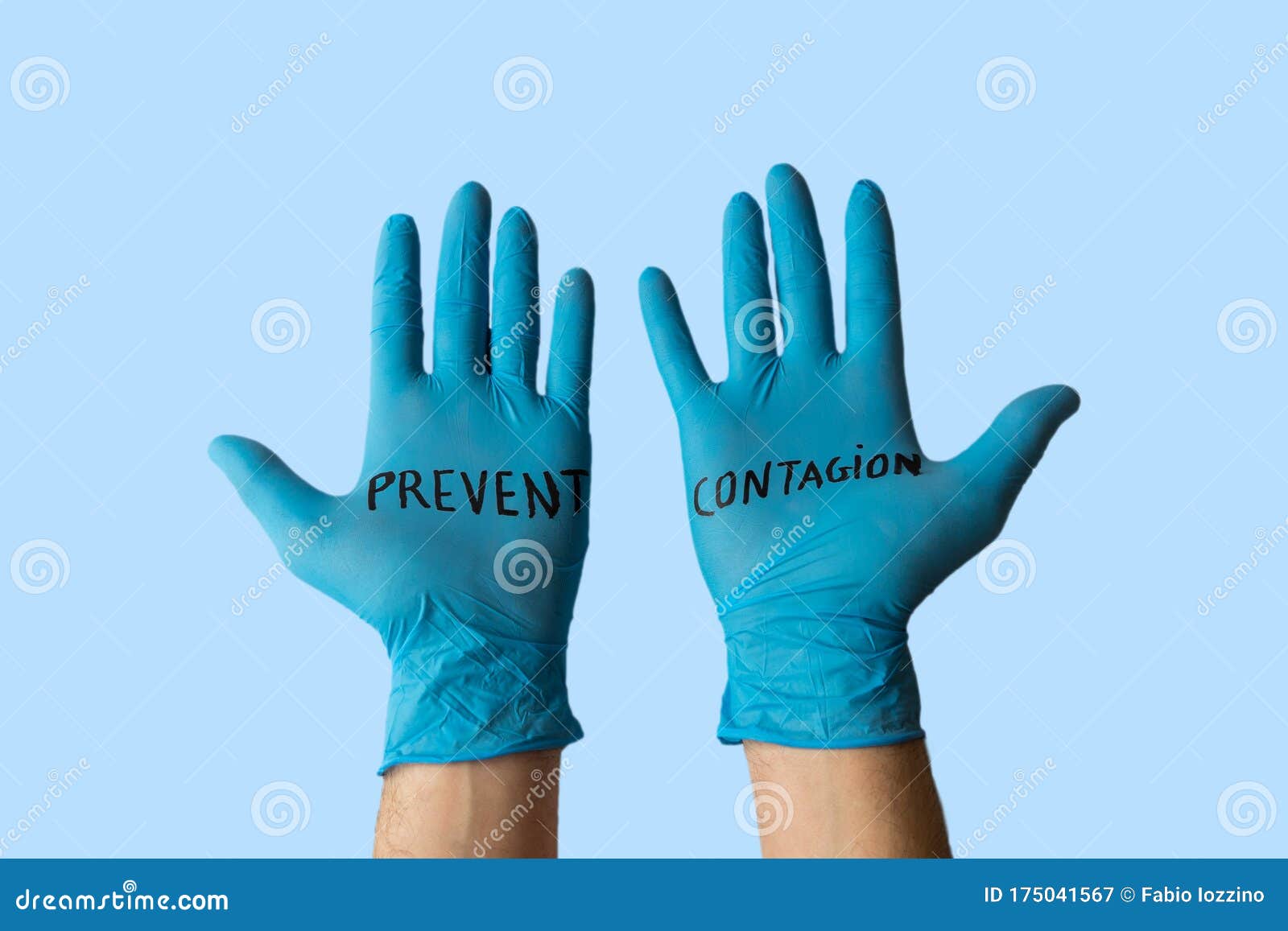 hands with gloves with written on it prevent the infection. health prevention and safety concept