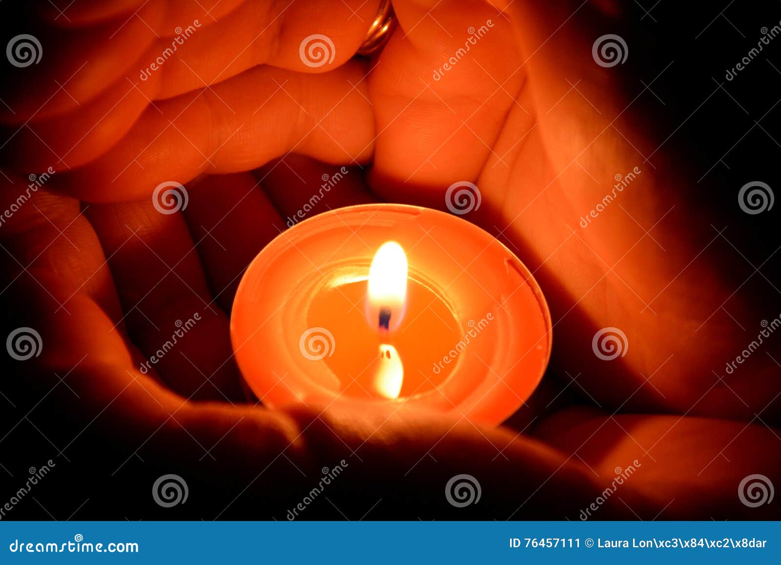 Hands holding a candle stock image. Image of light, darknessn 76457111