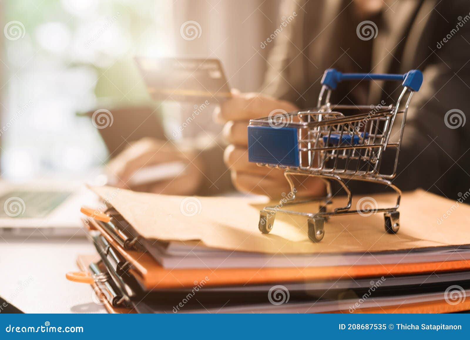 Hands Holding Credit Card and Using Calculator. Online Shopping Stock