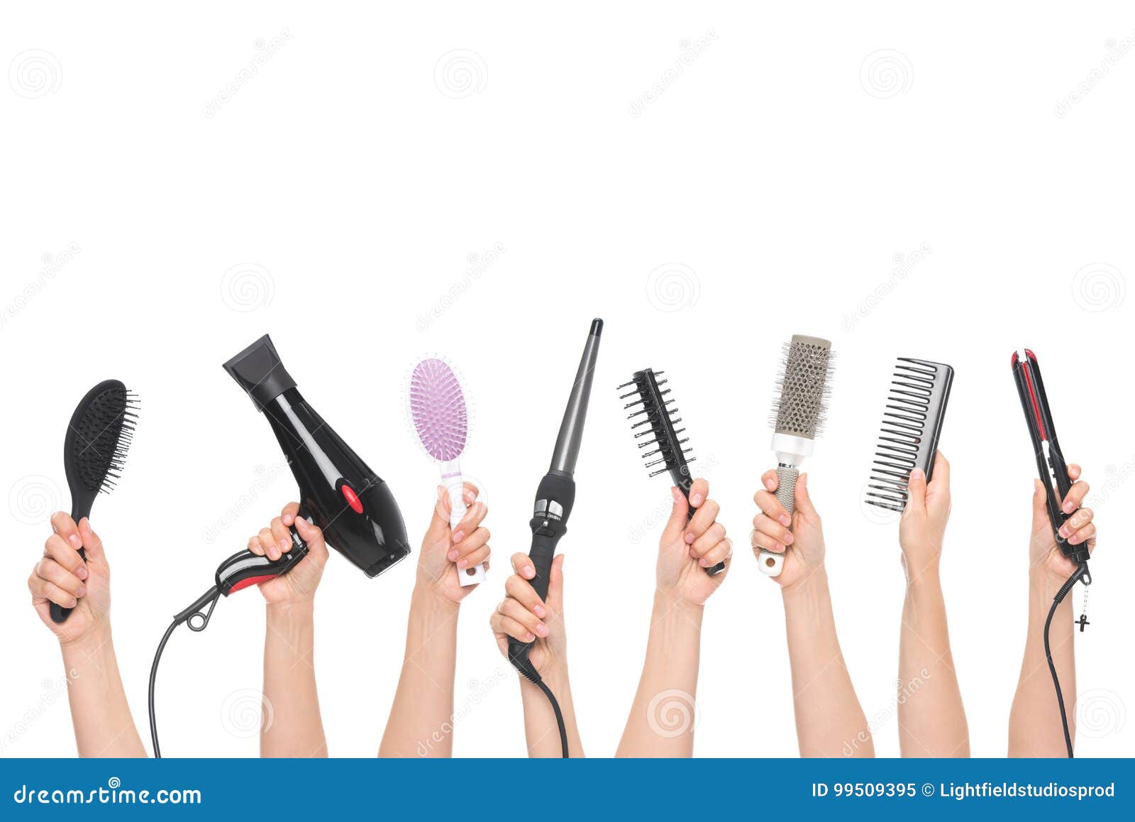hands holding hairdressing tools