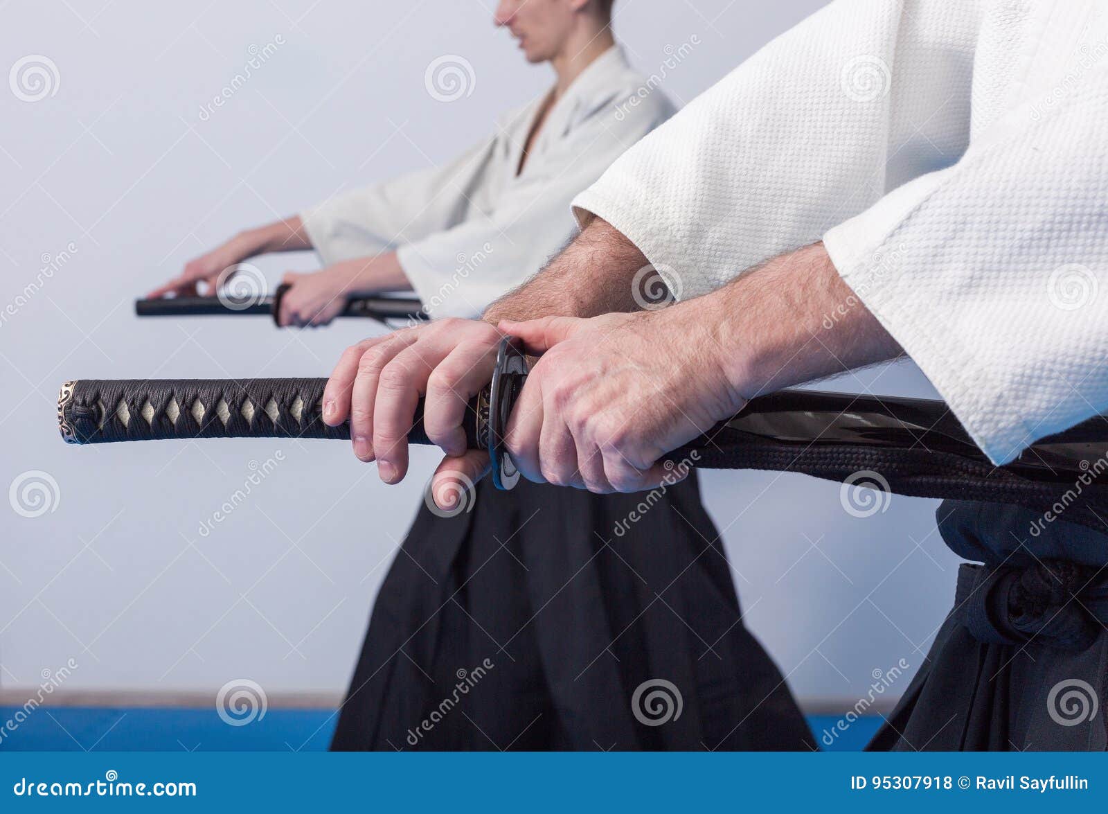 Hands holding the Katana stock photo. Image of iaito 95307918