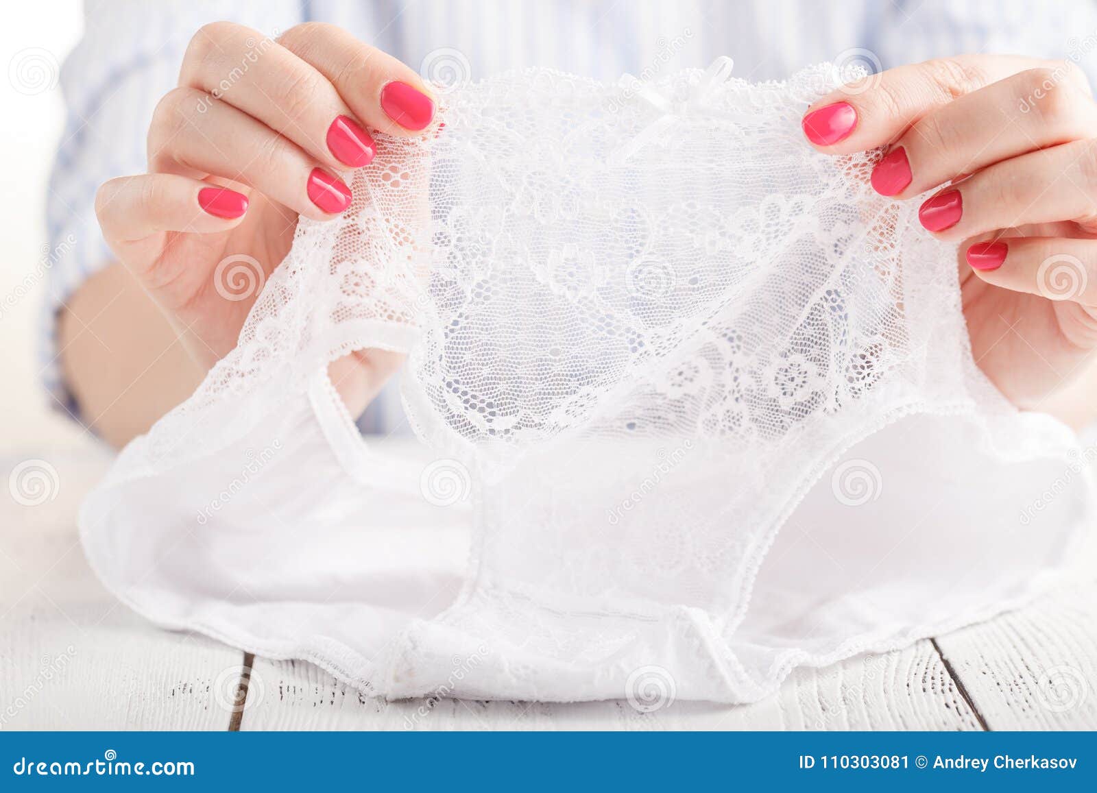 Hands Holding Woman`s Panties on the White Background Stock Image ...