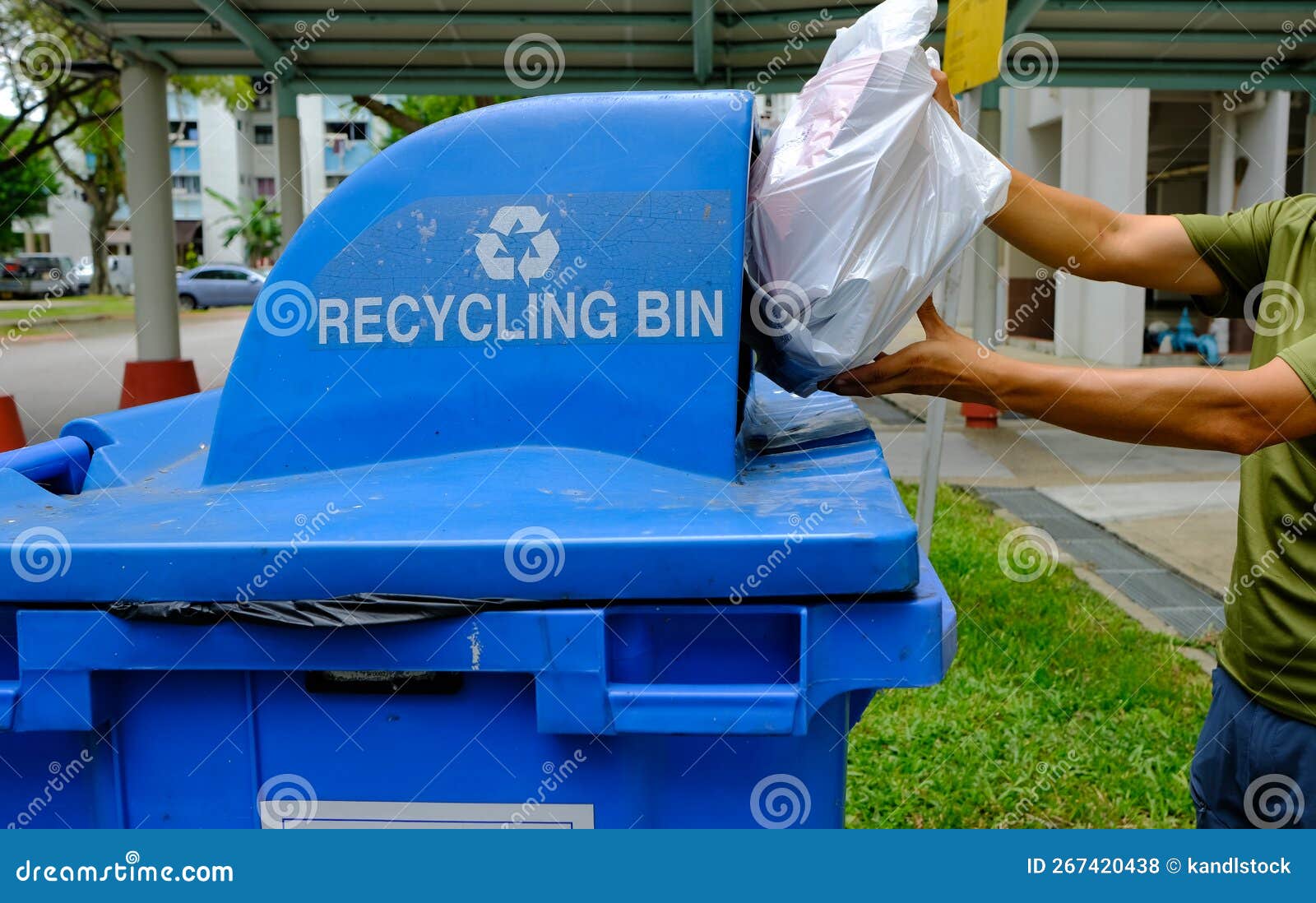 _ Hands Holding White Trash Bag of Recyclable Items Materials Putting