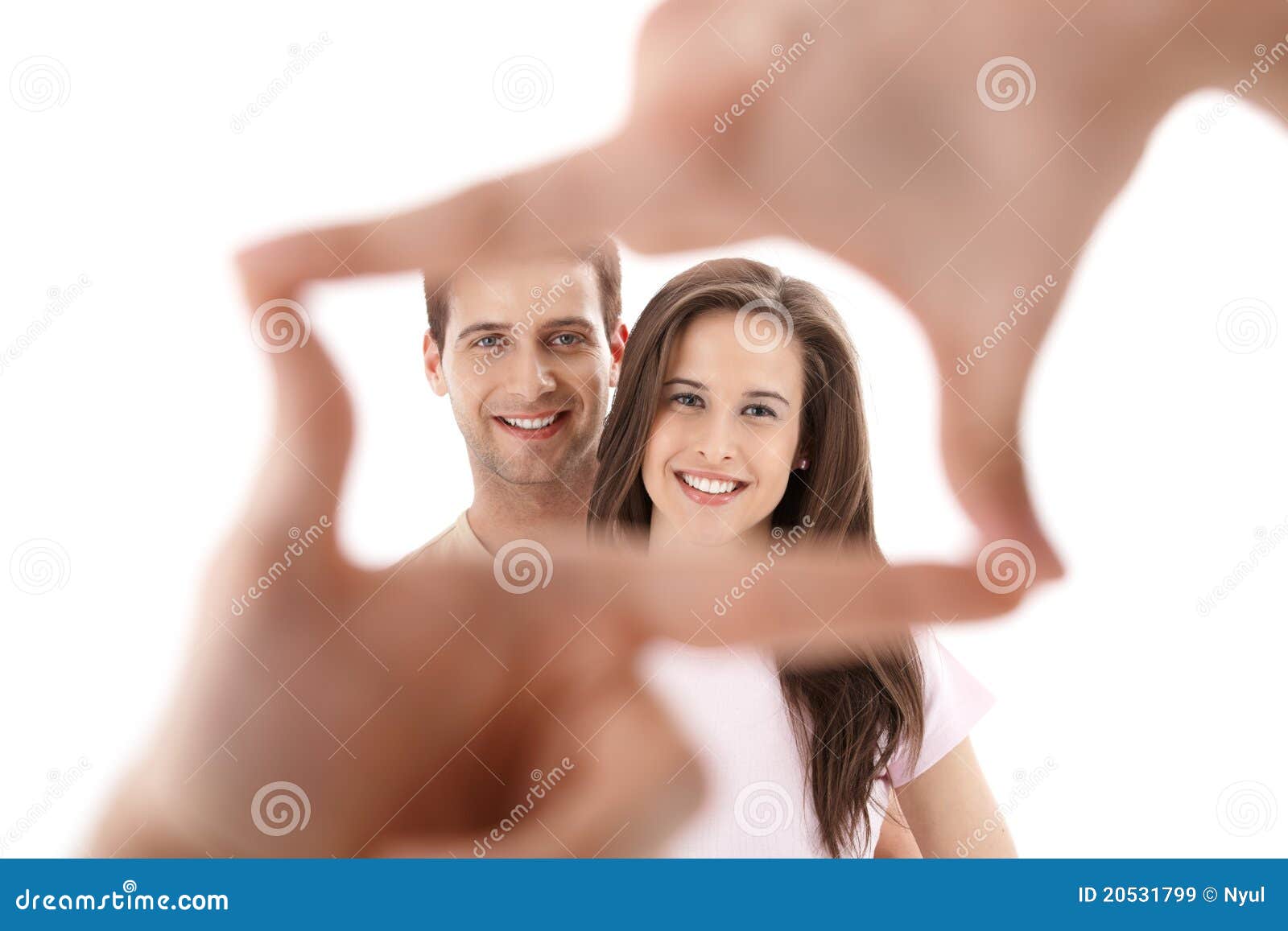 hands imitating frame for couple photo