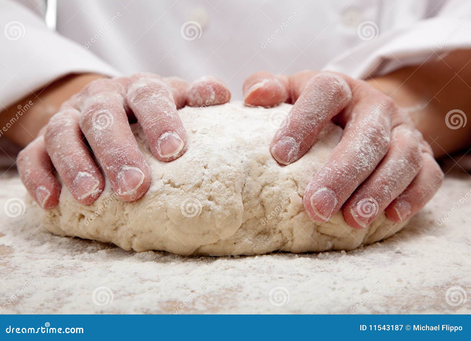 hands kneading bread dough