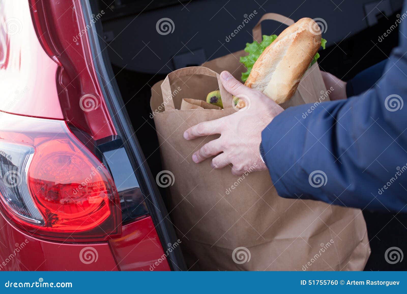 Hands Loading a Shopping Bag in Car Trunk Stock Photo Image of gift