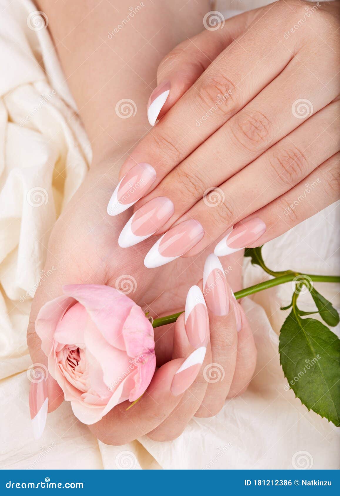 hands with long artificial french manicured nails