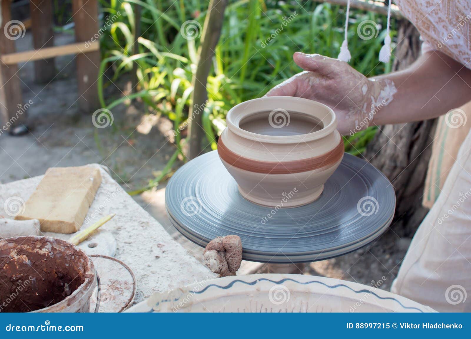 Hands of Making Clay Pot on the Pottery Wheel ,select Focus, Closeup