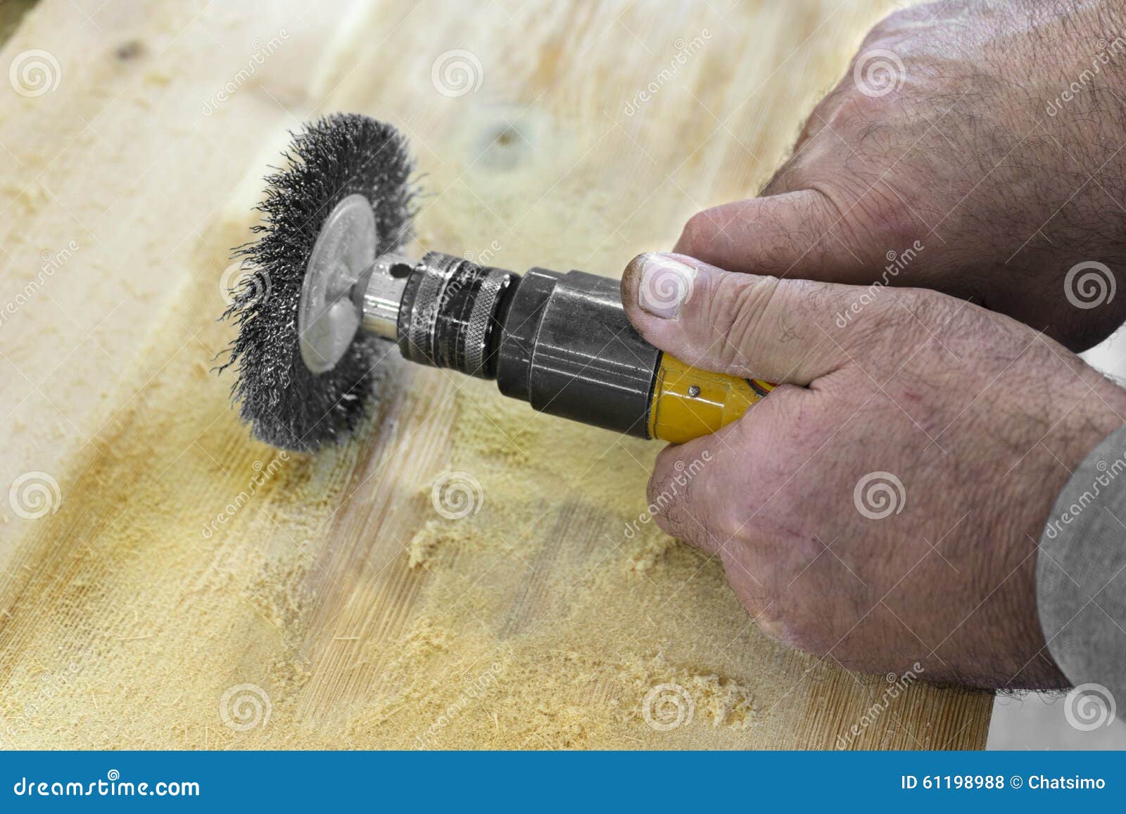 Hands Man with Electrical Rotating Brush Metal Disk Sanding Piec Stock