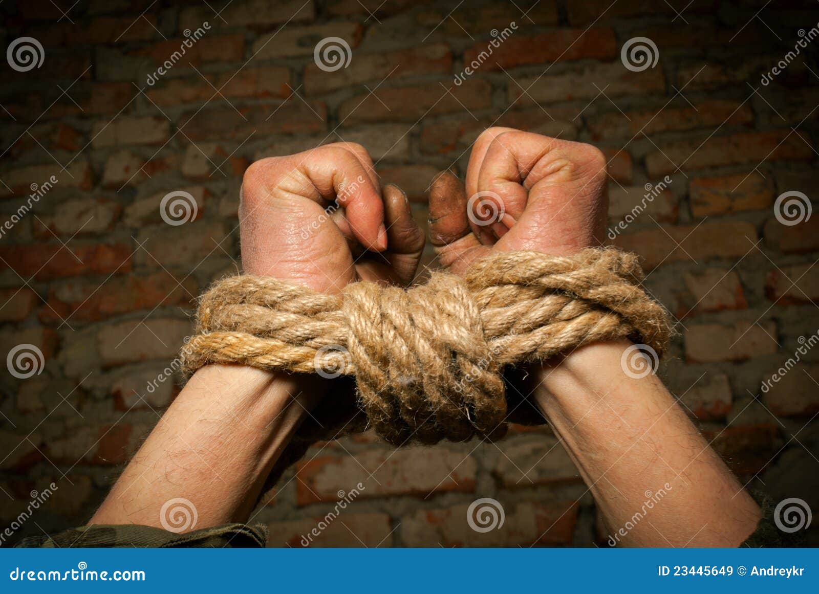 hands of man tied up with rope