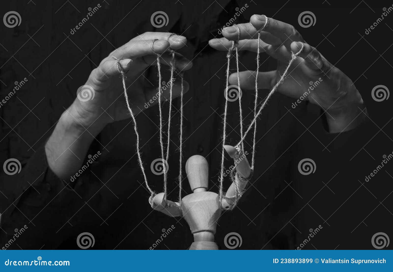 Hands Manipulating Puppet. Master of in Action Stock Image