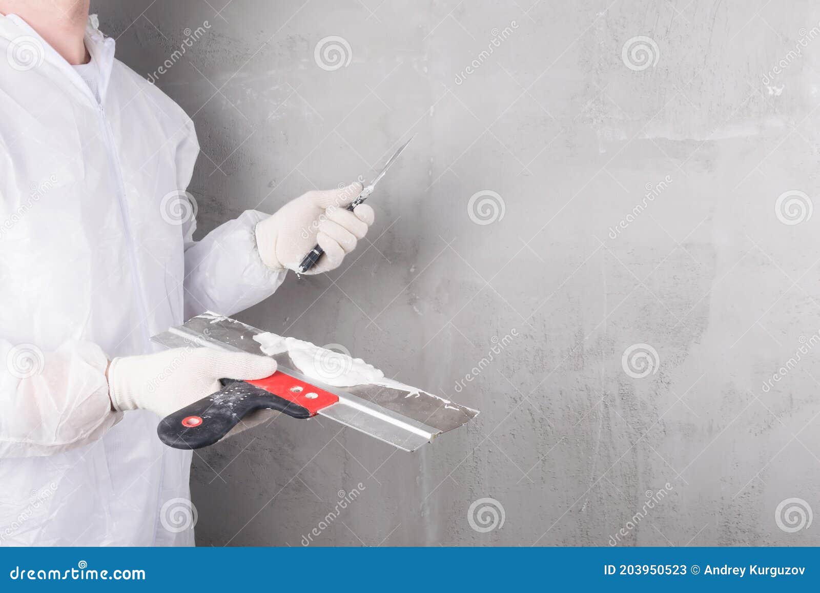 The Hands of the Master Hold a Spatula To Level the Walls Stock Image