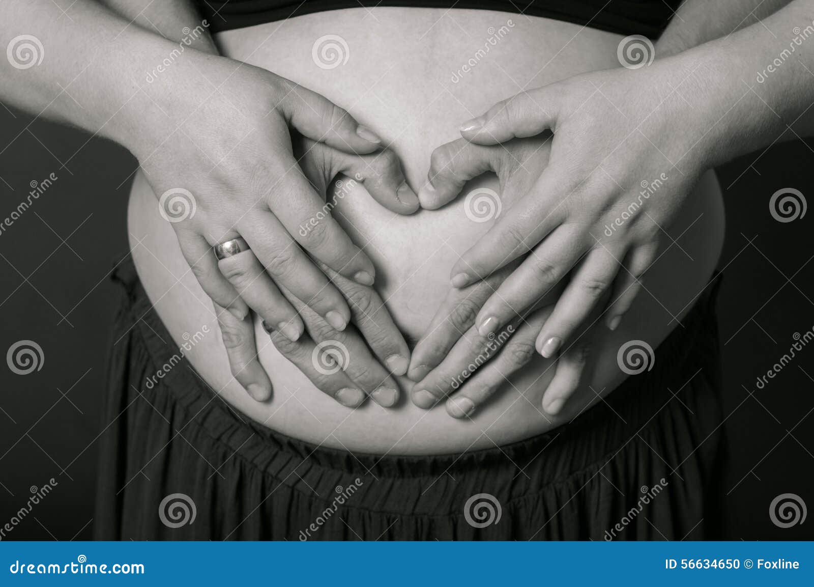 Hands of Men and Women on Pregnant Belly Stock Photo - Image of ...