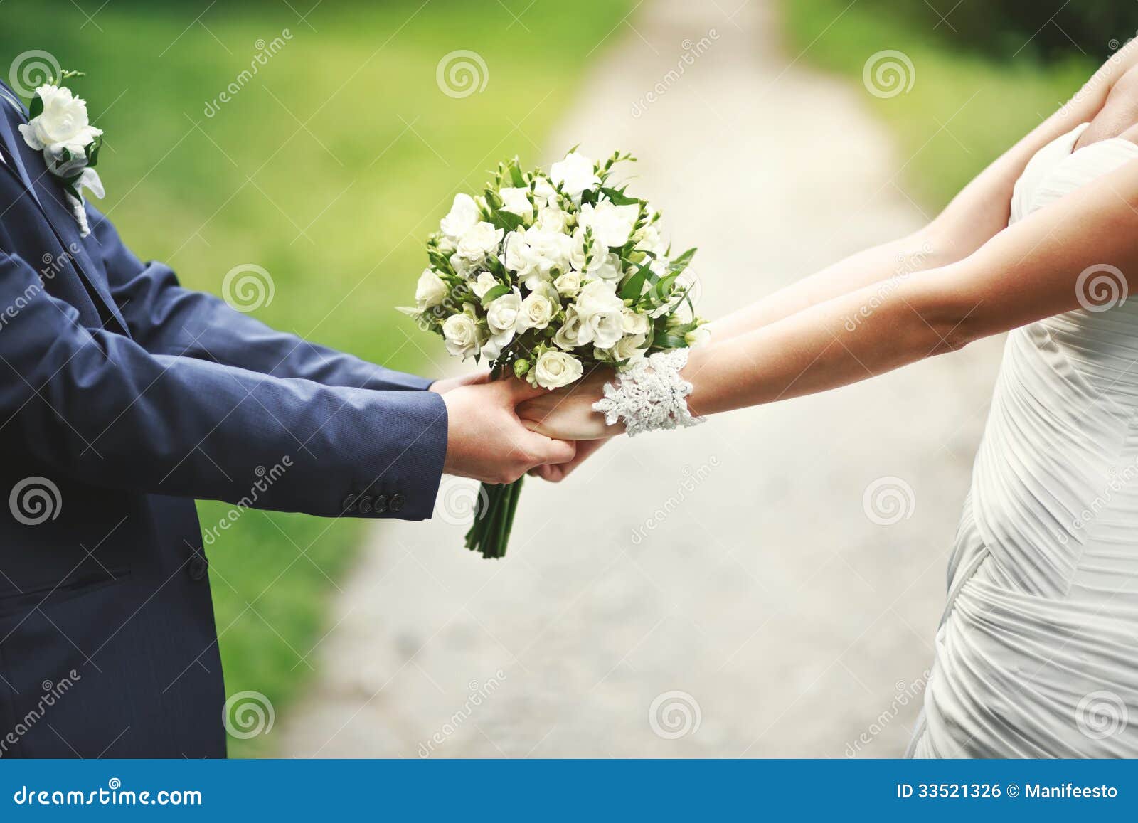 hands of a newly wed couple together
