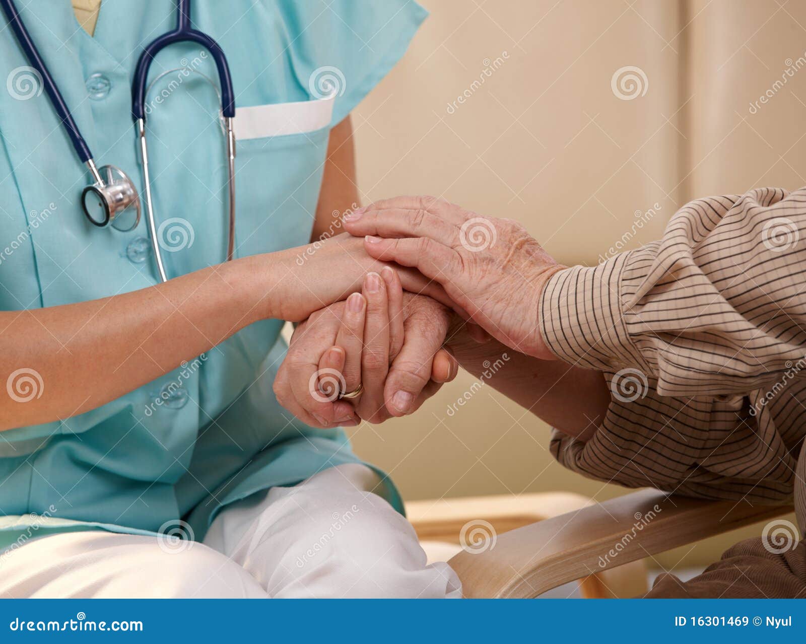 hands of nurse and elderly patient.