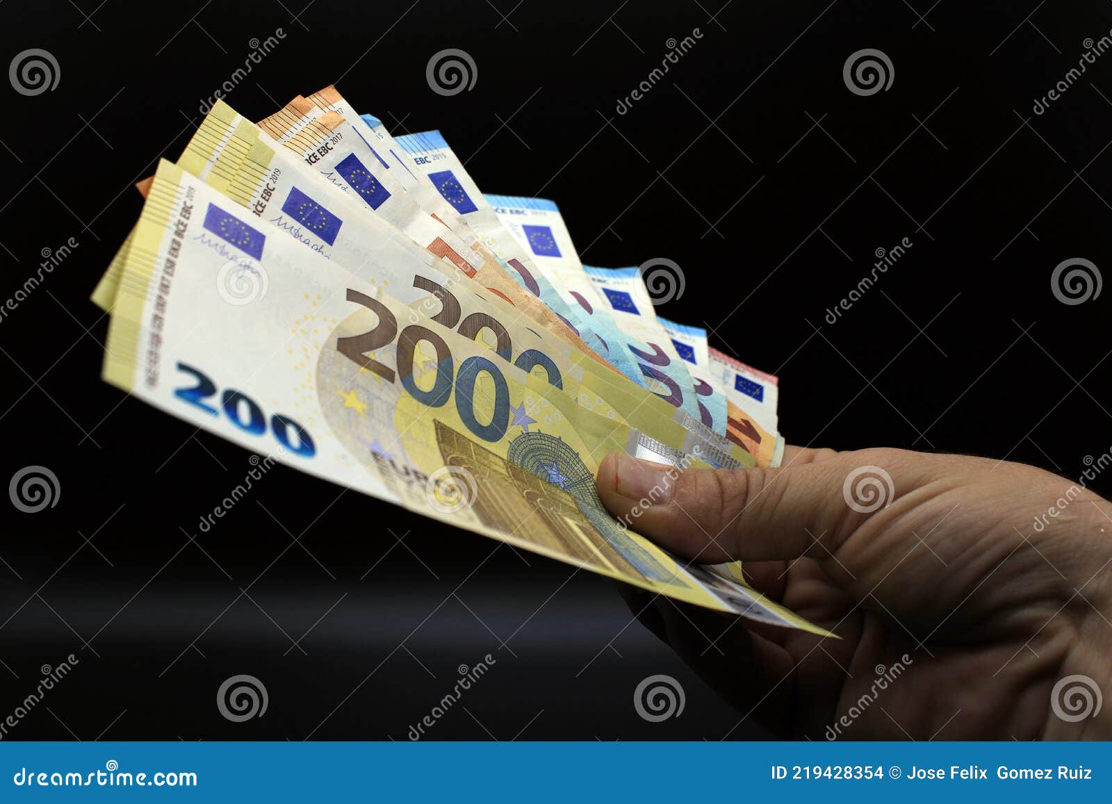 hands offering euro bills