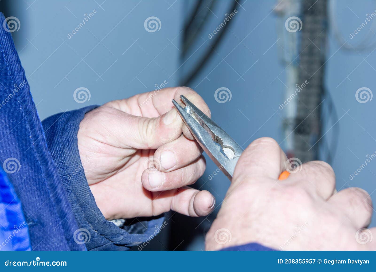 Hands of a Person Holding a Pliers Stock Image Image of closeup