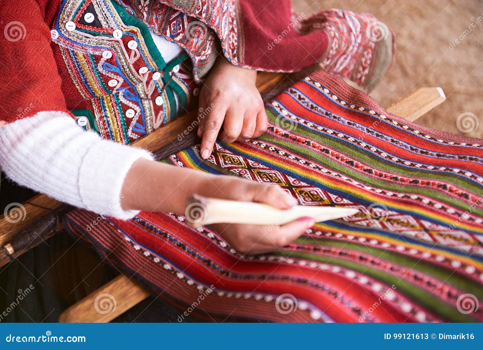 hands of peruvian woman making alpaca wool