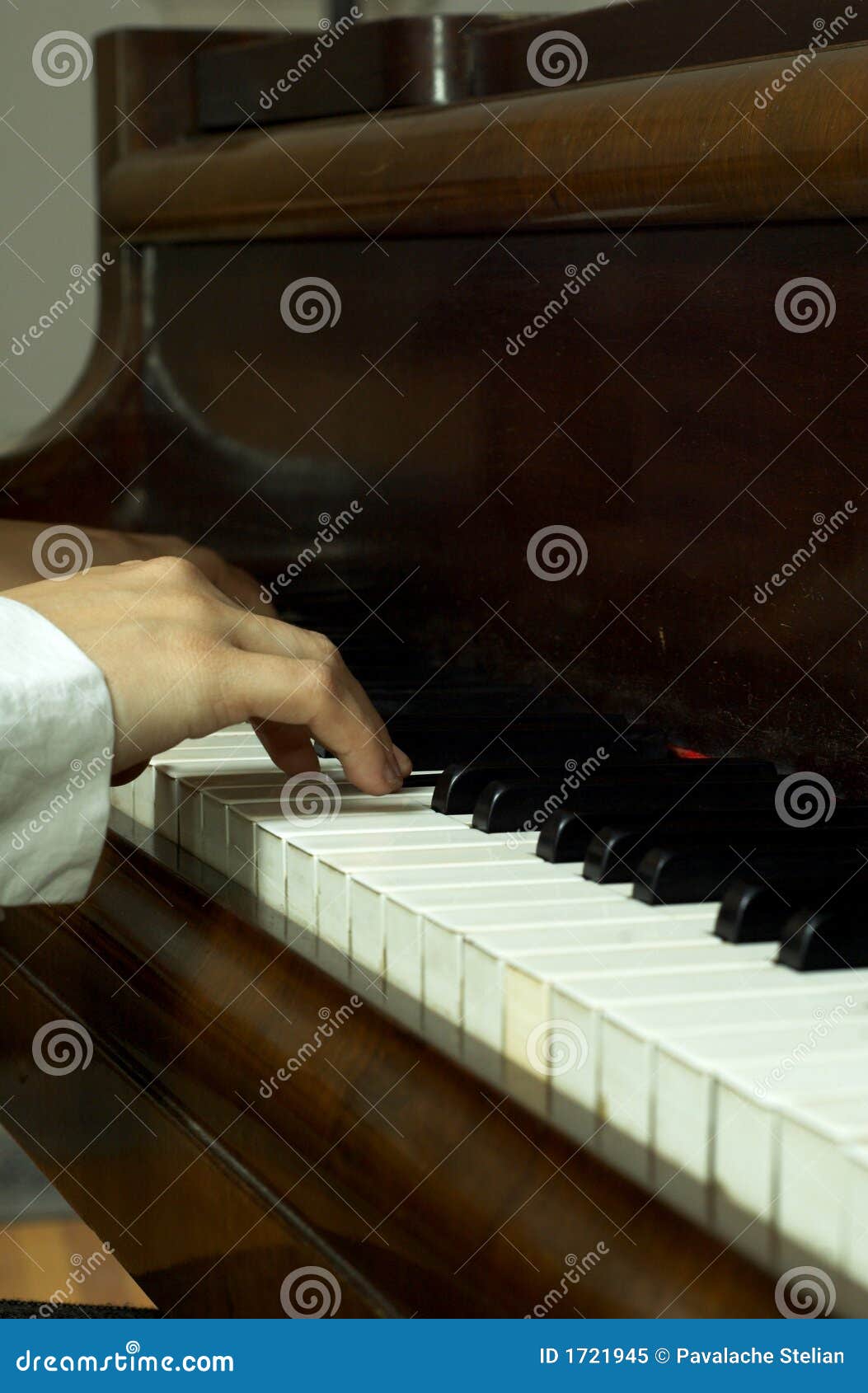 hands of a pianist at the piano