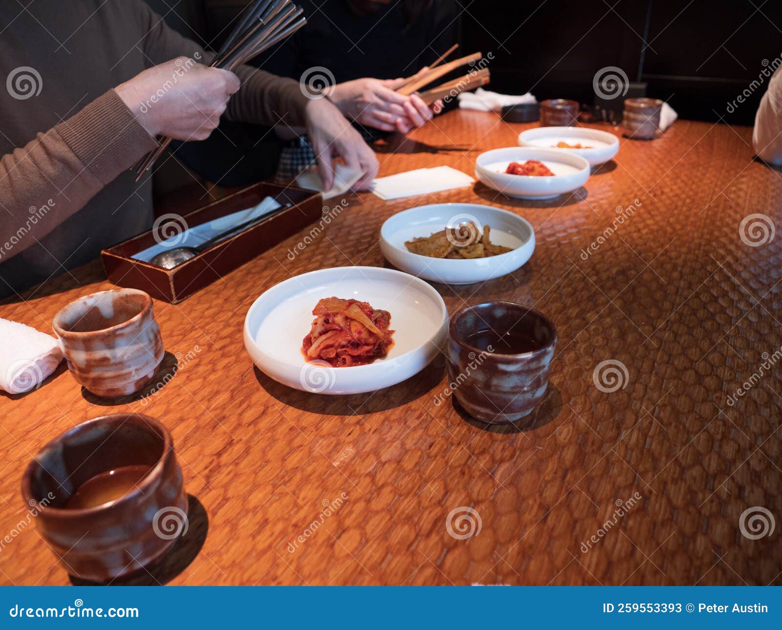 Hands Picking at Side Dishes in a Korean Restaurant Stock Image Image