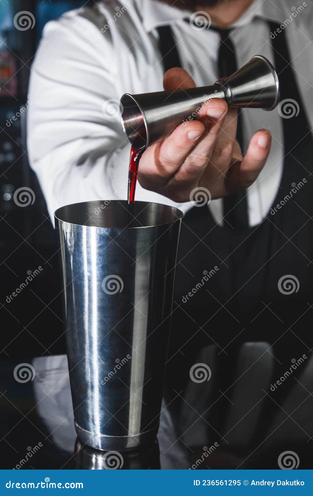 The Hands of a Professional Bartender Pour Syrup into a Measuring Glass of  Jigger in a Metal Tool for Preparing and, Stirring Stock Image - Image of  background, alcoholic: 236561295