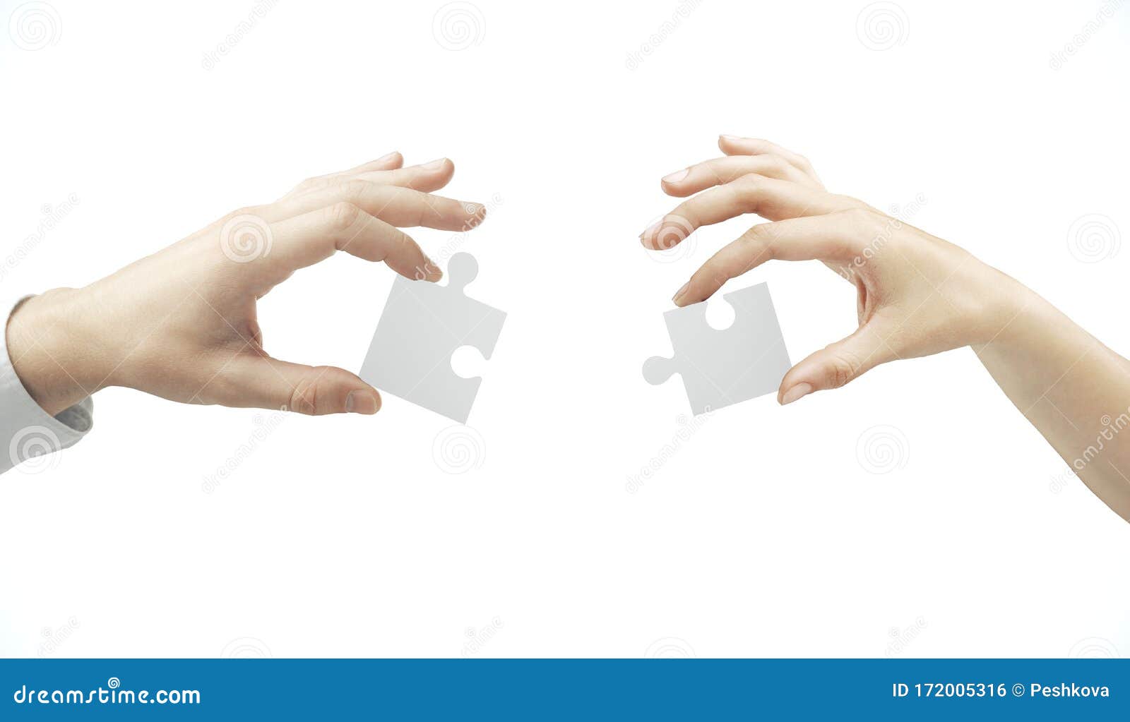 hands putting puzzle pieces together