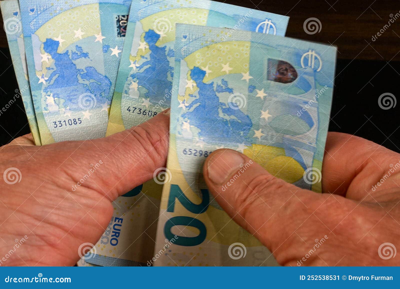 hands several cash twenty euro bills, recalculation banknotes. parsimony, savings, home finance