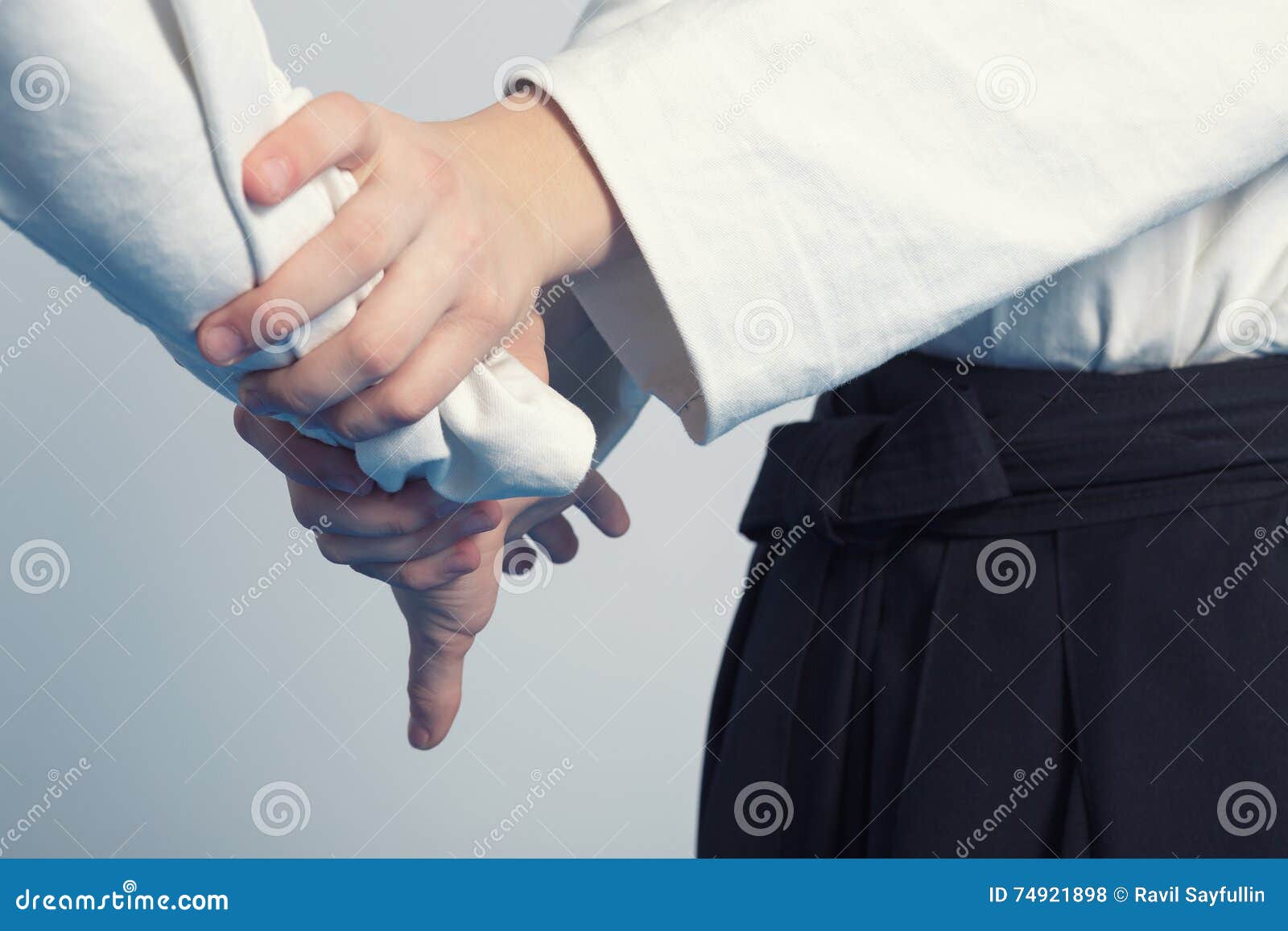 Hands of Two Girls Standing in Stance on Martial Arts Training Stock