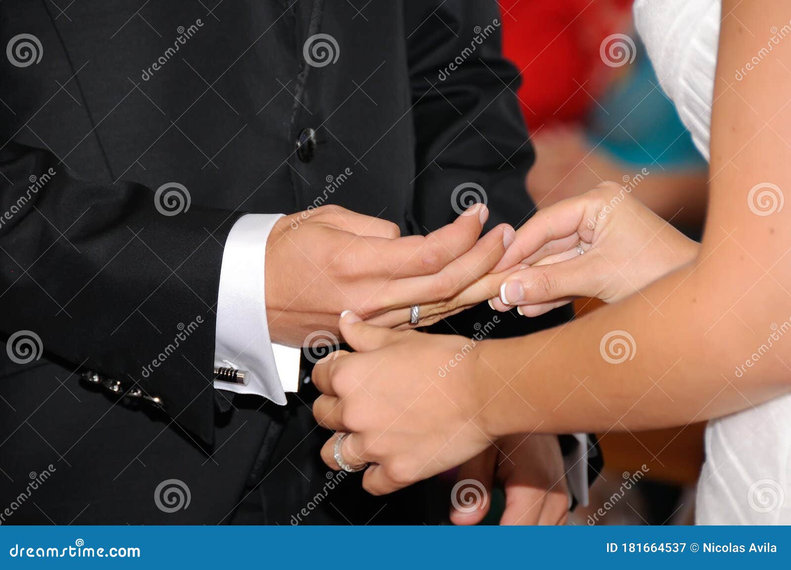 hands of wedding couple at their wedding while the bride