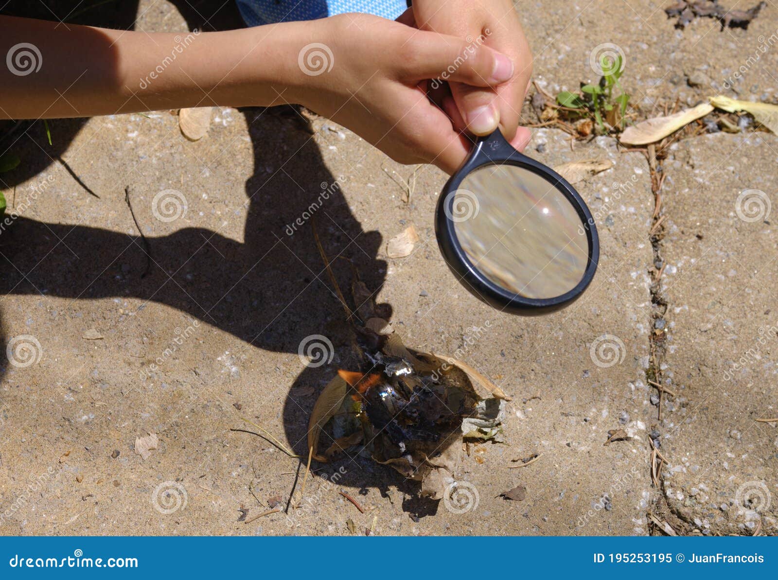 Making fire with glass stock image. Image of identity 195253195