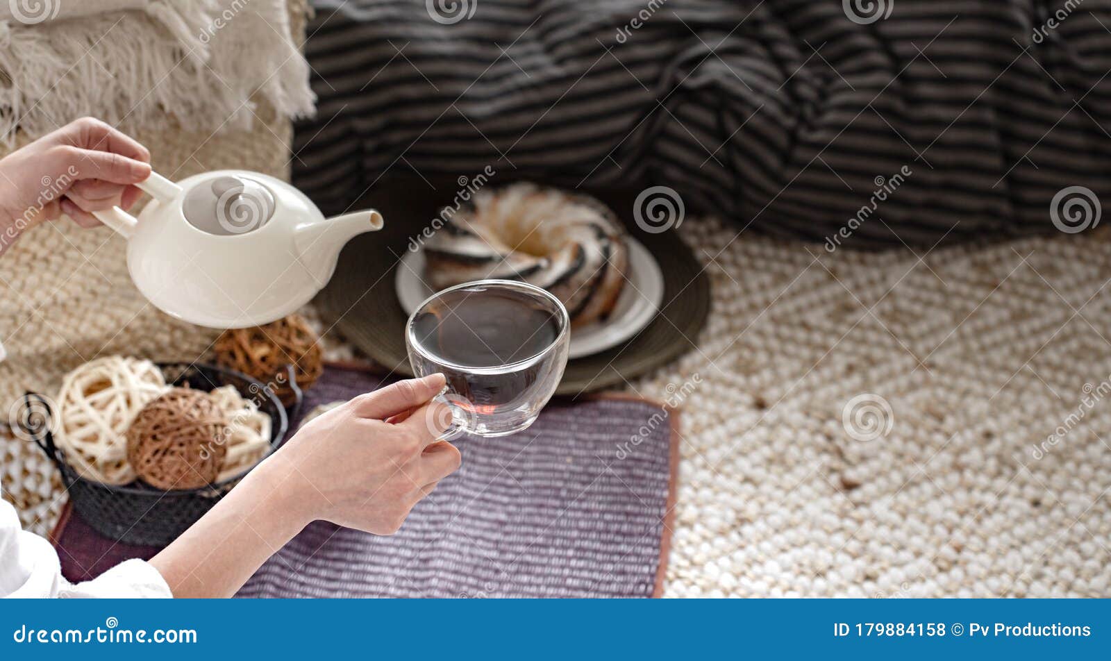 Hands of a Young Woman Pour Tea from a Teapot Stock Photo - Image of ...